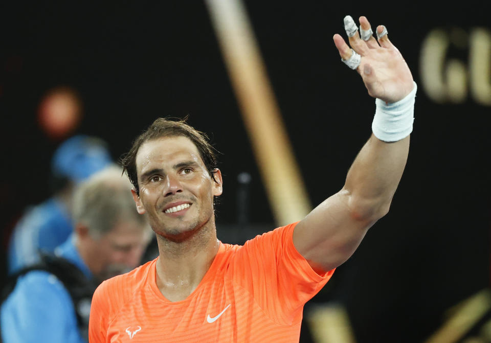 Spain's Rafael Nadal celebrates after defeating United States' Michael Mmoh during their second round match at the Australian Open tennis championship in Melbourne, Australia, Thursday, Feb. 11, 2021.(AP Photo/Rick Rycroft)