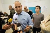 Naftali Bennett, head of the Israeli hardline national religious party Jewish Home, speaks to the media after voting in a polling station in Raanana, central Israel, on January 22, 2013