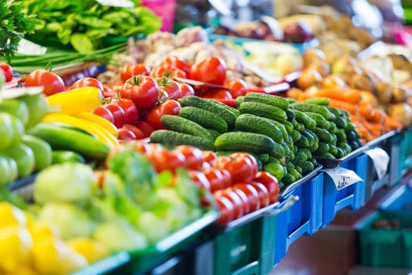 Aisle of fruits and vegetables at a grocery store