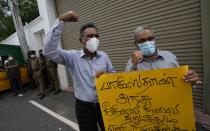 Members of Sri Lankan civil society organisations protest demanding justice for the Sri Lankan employee who has been lynched by Muslim mob in Sialkot last week outside Pakistani high commission in Colombo, Sri Lanka, Monday, Dec. 6, 2021. (AP Photo/Eranga Jayawardena)