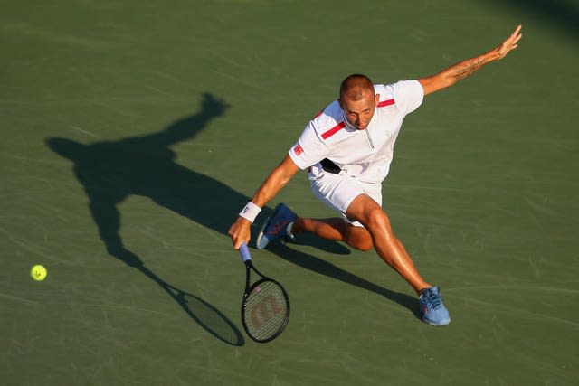 Dan Evans hits a backhand during his loss to Marin Cilic 