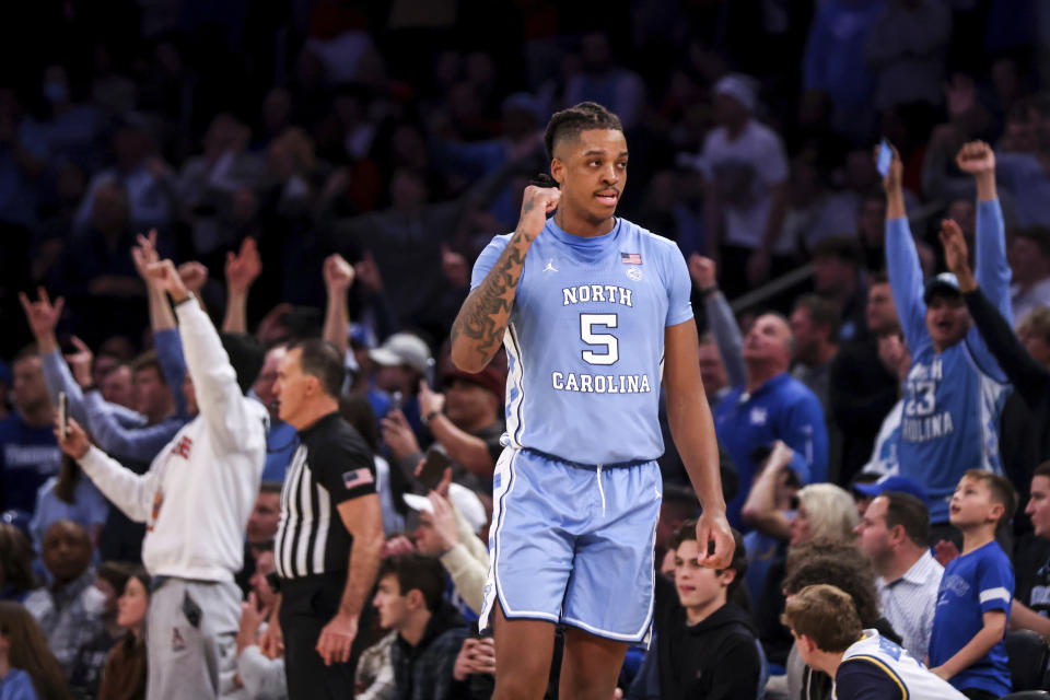 North Carolina forward Armando Bacot celebrates after beating Ohio State an NCAA college basketball game in the CBS Sports Classic, Saturday, Dec. 17, 2022, in New York. The Tar Heels won 89-84 in overtime. (AP Photo/Julia Nikhinson)