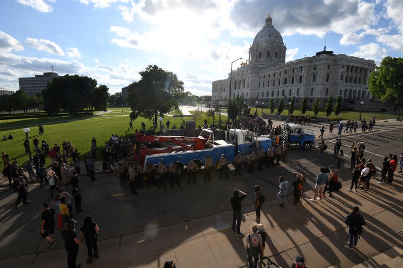 Demonstrators pulled down the statue of Christopher Columbus from the Minnesota State Capitol grounds