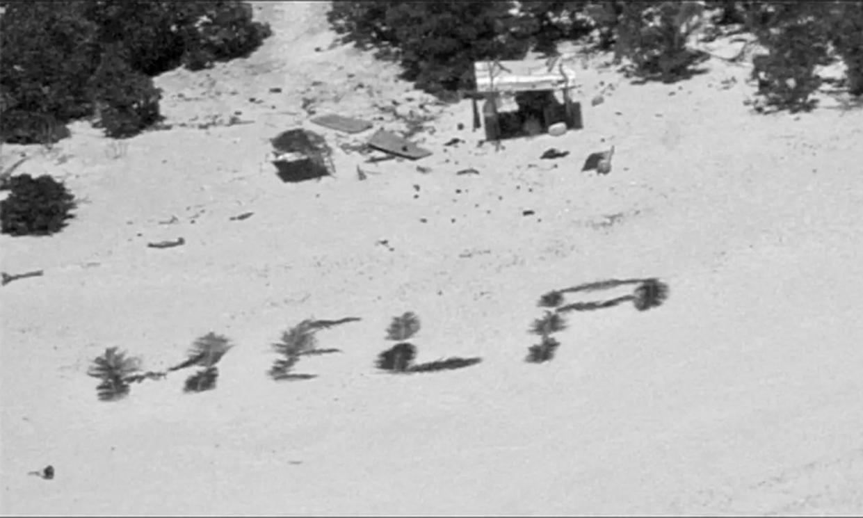 <span>Stranded fishermen on the Pikelot atoll spelled out ‘help’ with palm fronds.</span><span>Photograph: US Coast Guard Forces Micronesia</span>