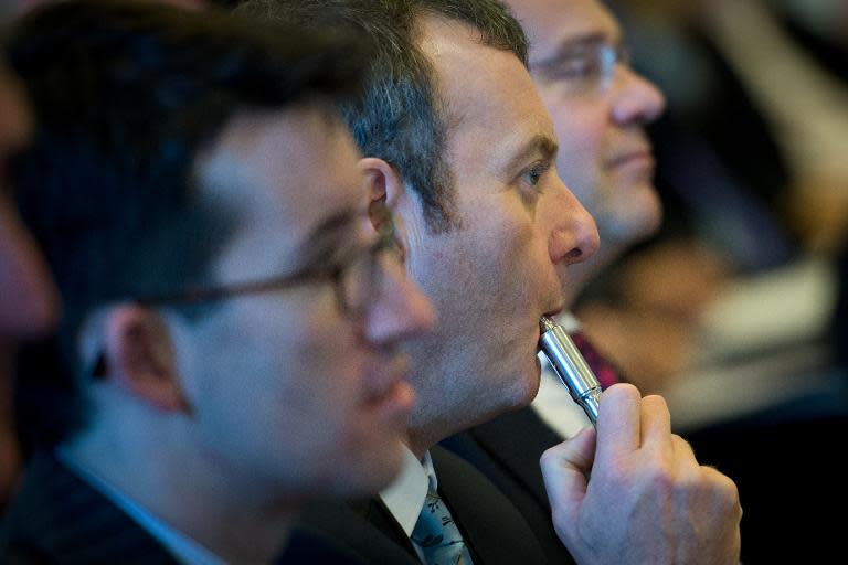 A delegate uses an e-cigarette during "The E-Cigarette Summit" at the Royal Academy in central London on November 12, 2013