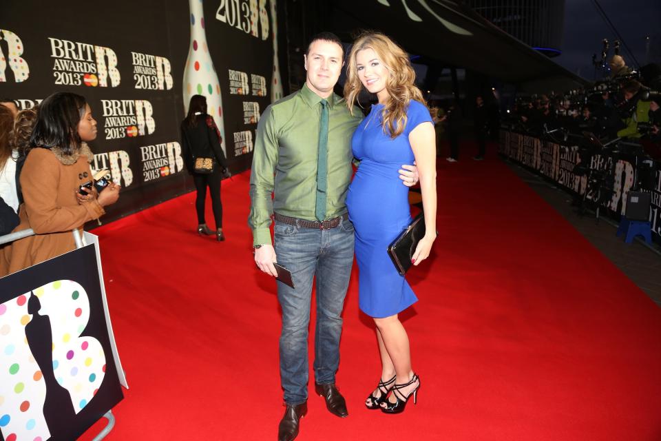 Paddy McGuinness, left, and wife Christine Martin seen arriving at the BRIT Awards 2013 at the o2 Arena on Wednesday, Feb. 20, 2013, in London. (Photo by John Marshall/Invision/AP)