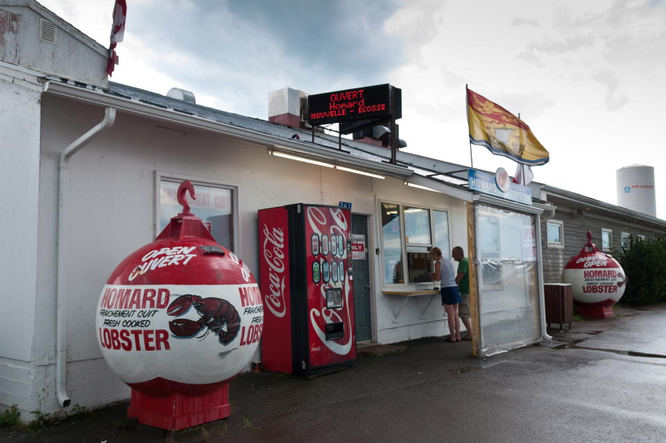 The Shediac Lobster shop, where fisherman have been protesting the purchase of Maine lobster for a cheaper price, is shown in Shediac, New Brunswick, Canada on Thursday, Aug.9, 2012. Lobster processing plants in New Brunswick resumed full operations Friday, a day after a judge ordered an injunction to prevent fishermen from blocking access in an ongoing dispute over the import of low-priced U.S. lobsters. Ronald LeBlanc, the lawyer representing the nine processing plants that applied for the injunction, said no demonstrations have been reported outside the plants since the 10-day injunction was granted Thursday. (AP Photo/The Canadian Press, Marc Grandmaison)