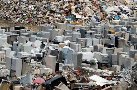 Broken refrigerators, caused by a flooding, are seen at a temporary waste-collection point at Mabi Clean Center in Kurashiki, Okayama Prefecture, Japan, July 13, 2018. REUTERS/Issei Kato