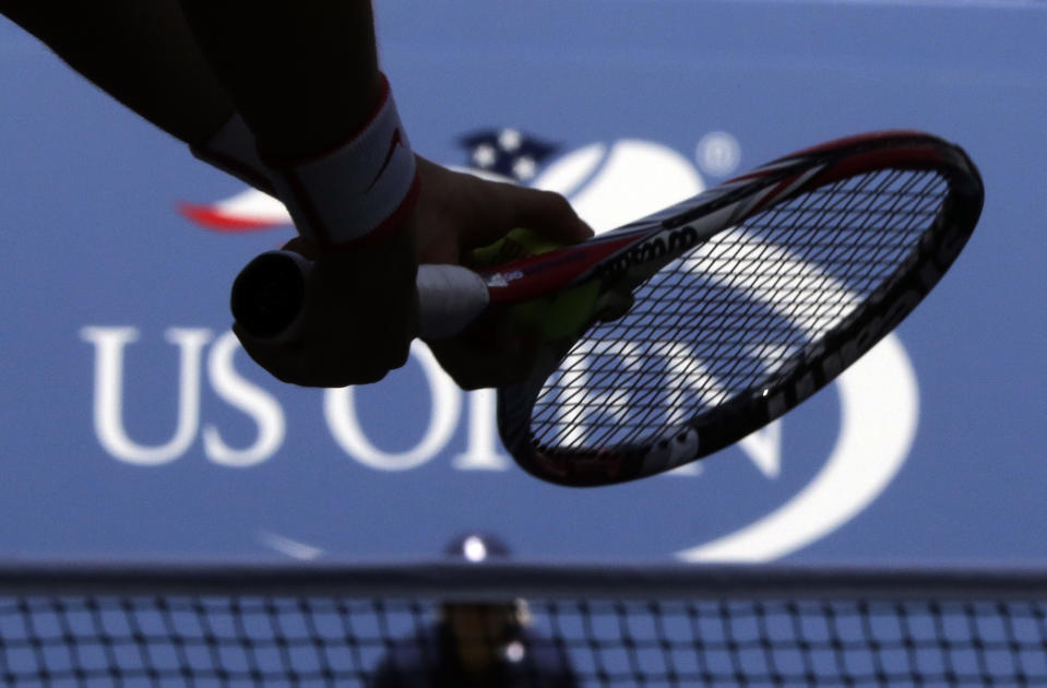 A player prepares to serve during the U.S. Open tennis tournament, Saturday, Sept. 5, 2015, in New York. An outside review of the U.S. Tennis Association’s safeguarding system makes 19 specific recommendations for how the group that oversees the sport in the country and runs the U.S. Open Grand Slam tournament can do more to protect players from abuse such as sexual misconduct. A 62-page report written by two lawyers was presented to the USTA Board of Directors last week and made public Thursday, June 27, 2024. (AP Photo/Charles Krupa, File)