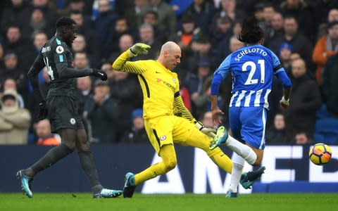 Willy Caballero of Chelsea challenges Matias Ezequiel Schelotto of Brighton and Hove Albion in the penalty area during the Premier League match between Brighton and Hove Albion and Chelsea at Amex Stadium on January 20, 2018 in Brighton, England - Credit: Getty Images