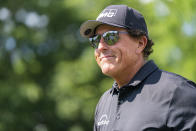 Phil Mickelson smiles to the crowd after the third hole during the first round of the Wells Fargo Championship golf tournament at Quail Hollow on Thursday, May 6, 2021, in Charlotte, N.C. (AP Photo/Jacob Kupferman)