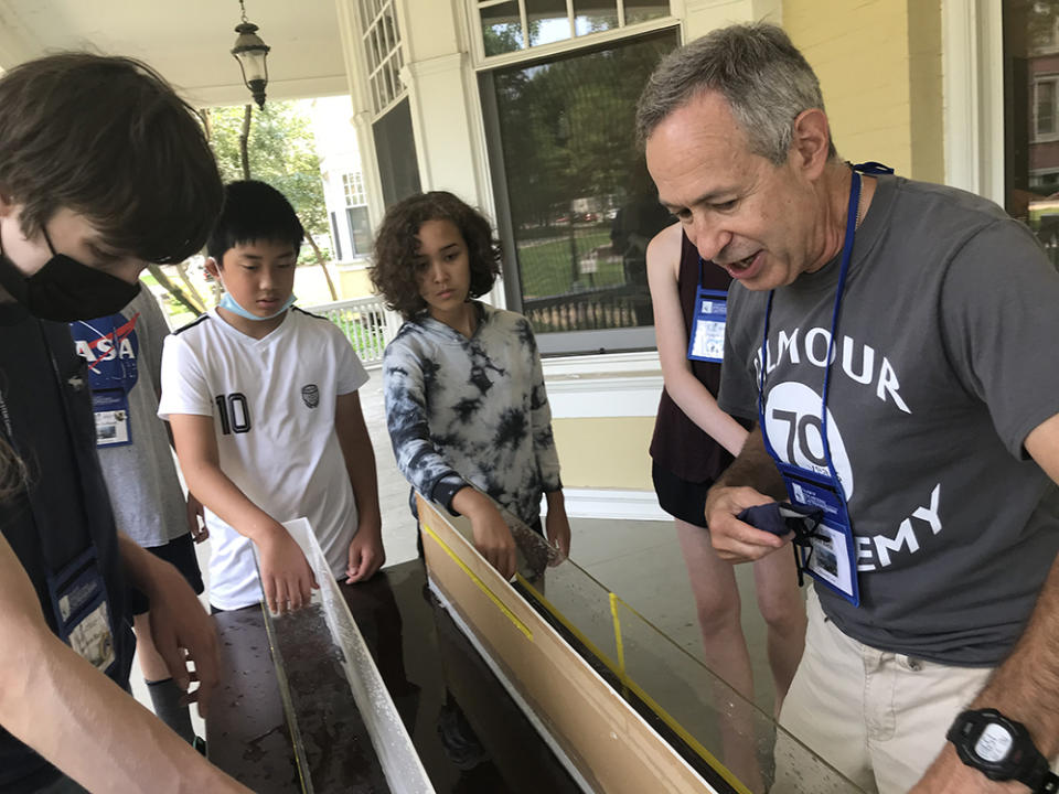 Teacher Jack Klein talks to students about how waves can change size as part of Shipwreck Camp on the campus of Case Western Reserve University. (Patrick O’Donnell)