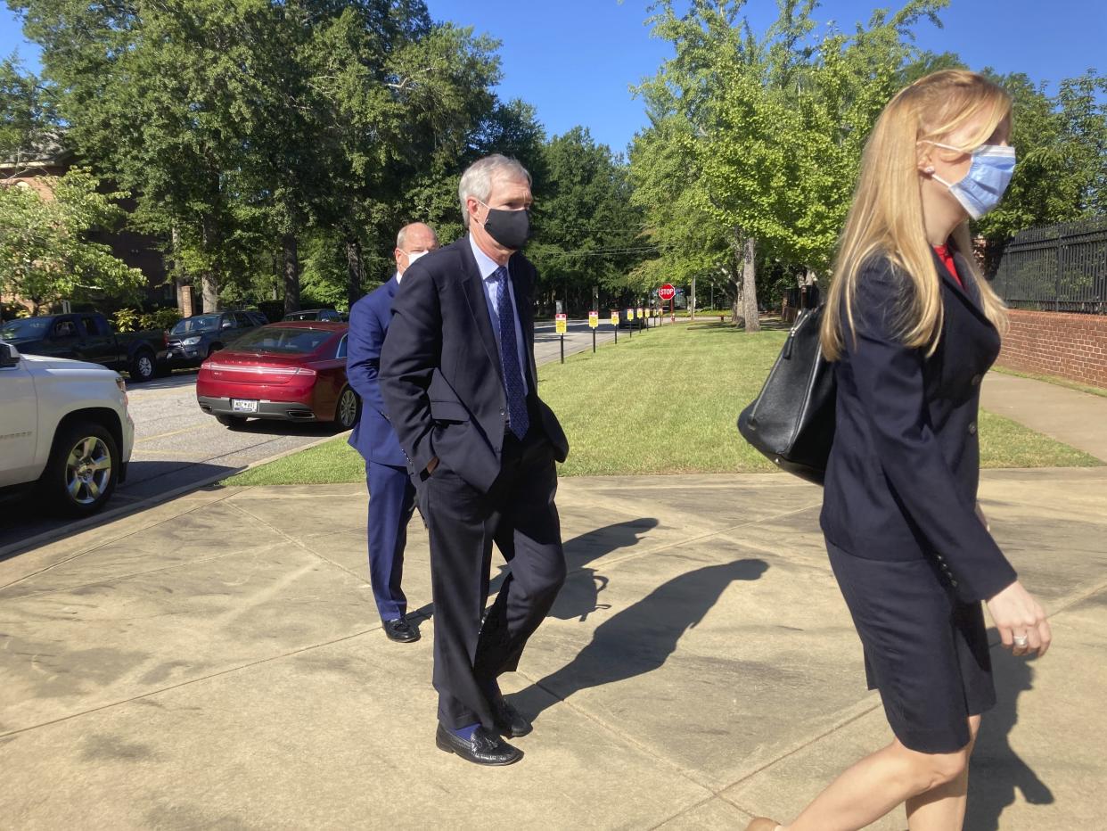Former SCANA Corp. Senior Vice President Stephen Byrne enters the Matthew J. Perry, Jr. Courthouse in Columbia, S.C. to enter a guilty plea to one count of conspiracy to commit mail and wire fraud Thursday, July 23, 2020. Byrne agreed to cooperate with prosecutors in a federal investigation into the failed V.C. Summer nuclear project in South Carolina. (AP Photo/Michelle Liu)