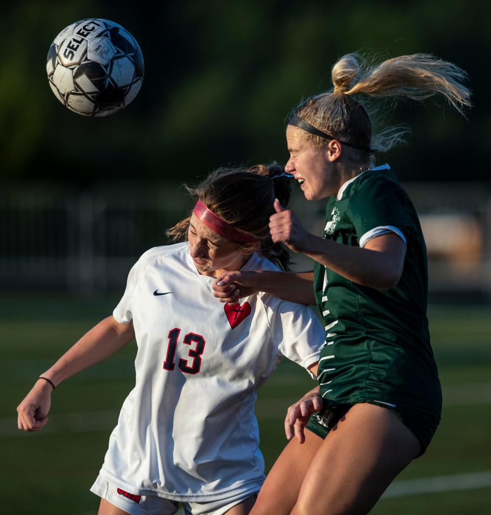 South Oldham's Katie Beth May gets off a header against Sacred Heart''s Lilia Work. Aug. 24, 2022