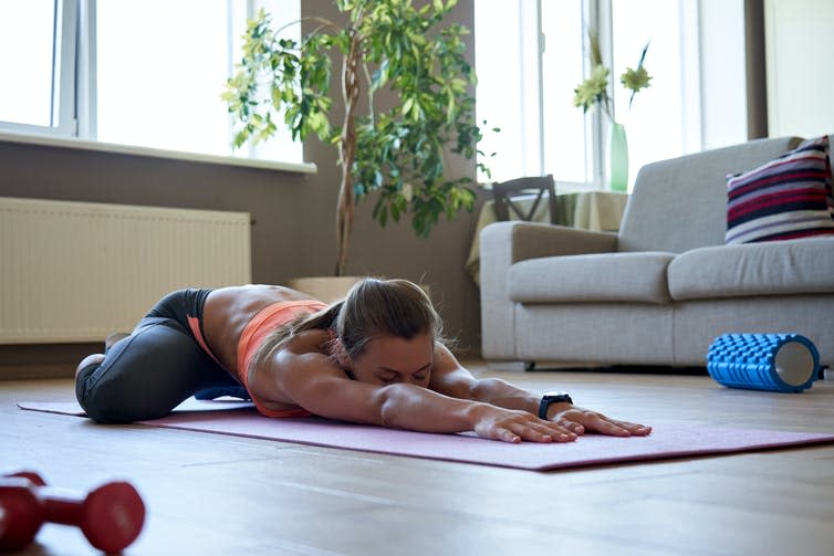 Girl exercising at home.