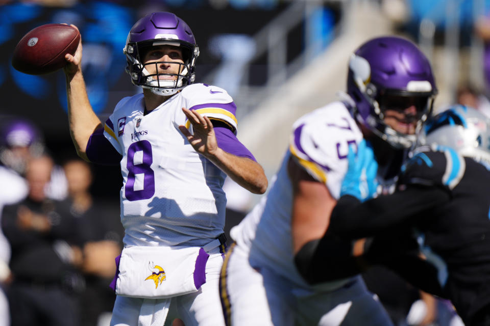 Minnesota Vikings quarterback Kirk Cousins (8) works in the pocket against the Carolina Panthers during the first half of an NFL football game, Sunday, Oct. 17, 2021, in Charlotte, N.C. (AP Photo/Jacob Kupferman)