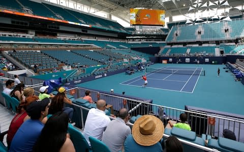 Novak Djokovic practices for the Miami Open tennis tournament at Hard Rock Stadium, Monday, March 18, 2019, in Miami Gardens, Fla. The Miami Open has moved north from its home since 1987, the picturesque island of Key Biscayne, and will begin Tuesday at the home of the Miami Dolphins and Miami Hurricanes - Credit: AP