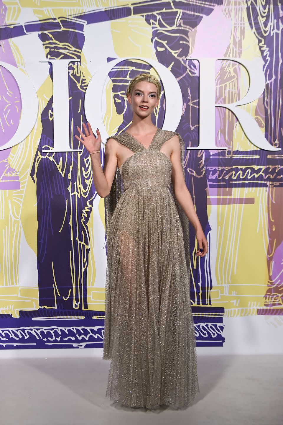 <p>The actor attended the Dior Cruise 2022 show in Athens wearing a shimmering gold Grecian-style gown by Dior.</p>