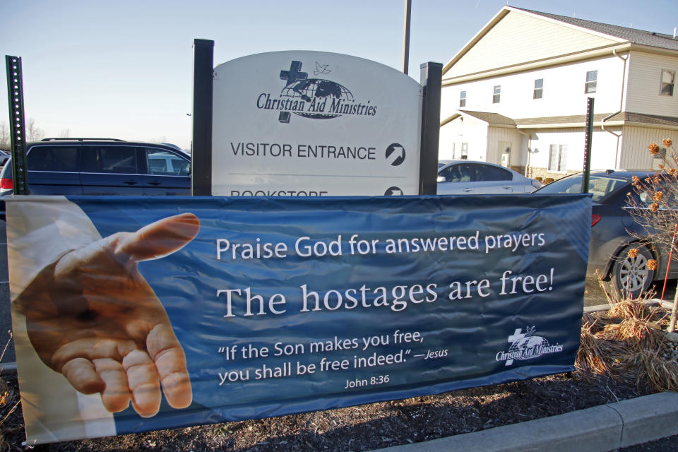 FILE - A banner for the freed hostages is displayed at Christian Aid Ministries in Berlin, Ohio Monday, Dec. 20, 2021. On Wednesday, Jan. 5, 2022, workers for the Ohio-based missionary organization have confirmed that an unidentified person paid ransom to free three of their kidnapped colleagues from a Haitian gang under an agreement that was supposed to have freed all 15 of the captive group in early December. (AP Photo/Tom E. Puskar, File)