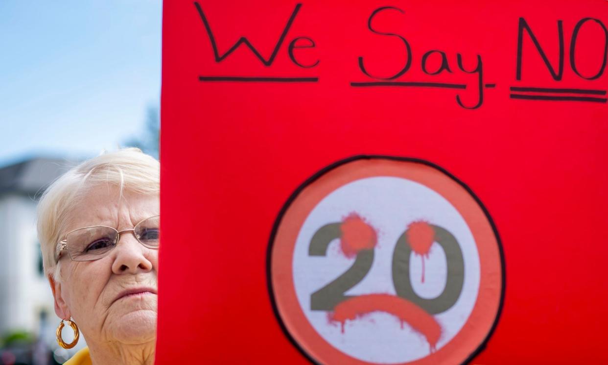 <span>A woman protests against the 20mph speed limit after its introduction in September last year.</span><span>Photograph: Matthew Horwood/Getty Images</span>