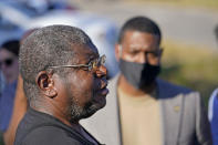 Resident Michael Coleman speaks to the media as EPA Administrator Michael Regan listens outside his home which abuts the Marathon Petroleum Refinery, as Regan tours Reserve, La., Tuesday, Nov. 16, 2021. (AP Photo/Gerald Herbert)