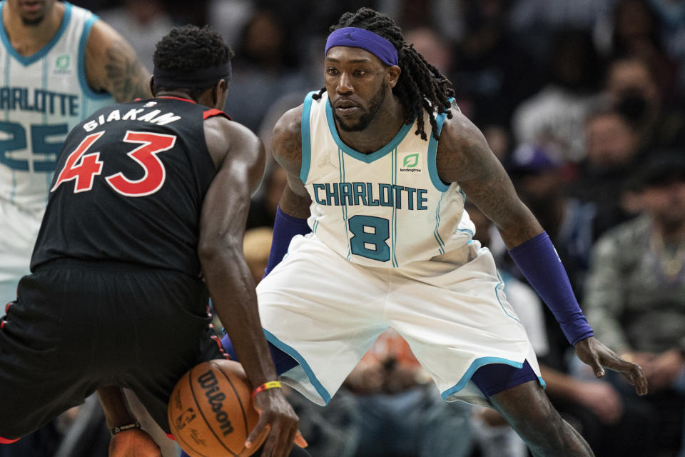 FILE - Charlotte Hornets center Montrezl Harrell (8) guards Toronto Raptors forward Pascal Siakam (43) during the first half of an NBA basketball game in Charlotte, N.C., Friday, Feb. 25, 2022. Harrell is facing a felony drug charge after authorities said they found vacuum-sealed bags of marijuana in his car during a traffic stop. According to court records, the 28-year-old Harrell was pulled over in Richmond, Ky., by a state trooper May 12, 2022, for driving behind a vehicle too closely. (AP Photo/Jacob Kupferman, File)