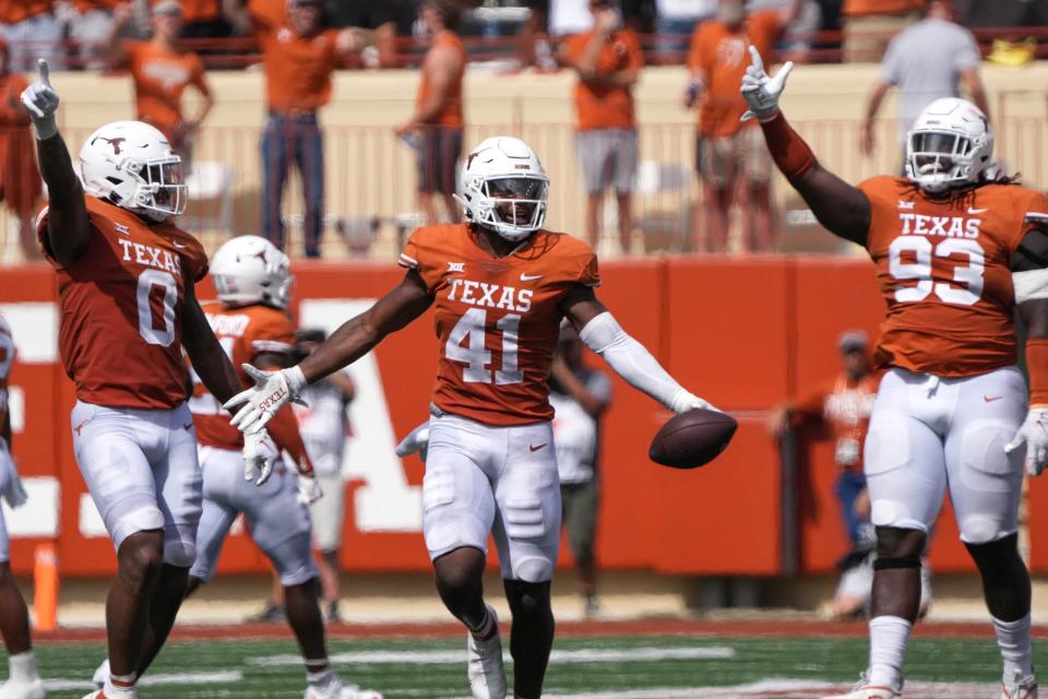 Texas Longhorns linebacker <a class="link " href="https://sports.yahoo.com/ncaaf/players/315869" data-i13n="sec:content-canvas;subsec:anchor_text;elm:context_link" data-ylk="slk:Jaylan Ford;sec:content-canvas;subsec:anchor_text;elm:context_link;itc:0">Jaylan Ford</a> (41) celebrates a late 4th quarter fumble recovery during the game against Iowa State at Royal Memorial Stadium in Austin, Texas on Oct. 15, 2022.