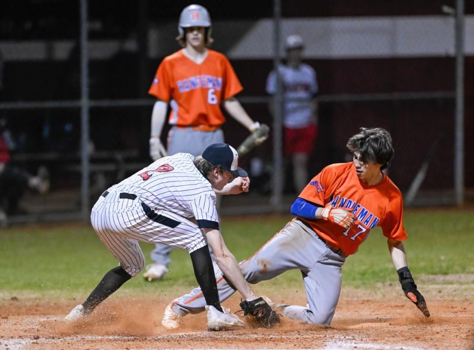 Bryson Sweatt slides home during Randleman's game at Wheatmore on Friday, March 19, 2022.