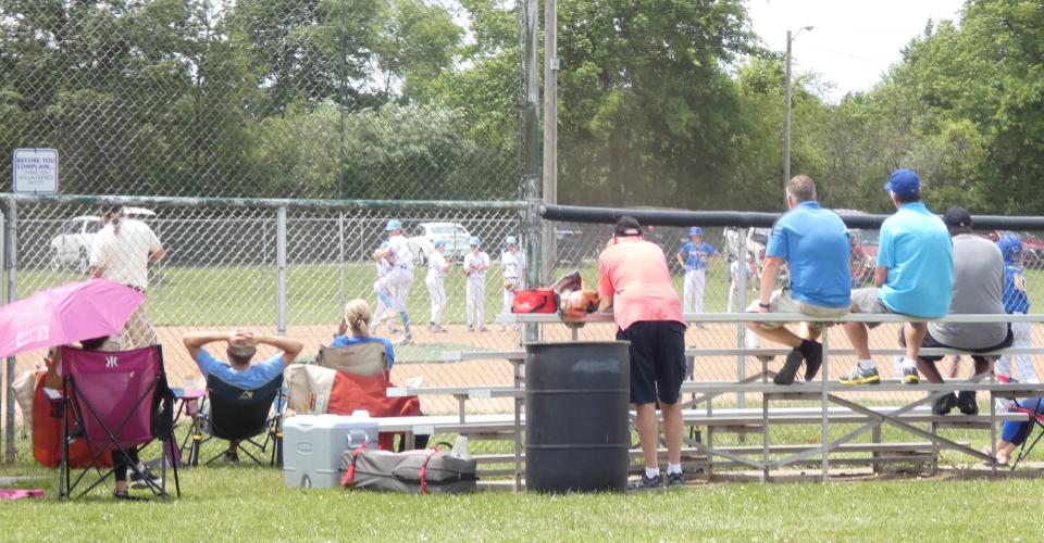 This weekend's Tommy Slugfest, organized by Bucyrus Little League, brought 49 teams, along with parents and coaches, to town. Spectators watch a game at Lions Field on Saturday.