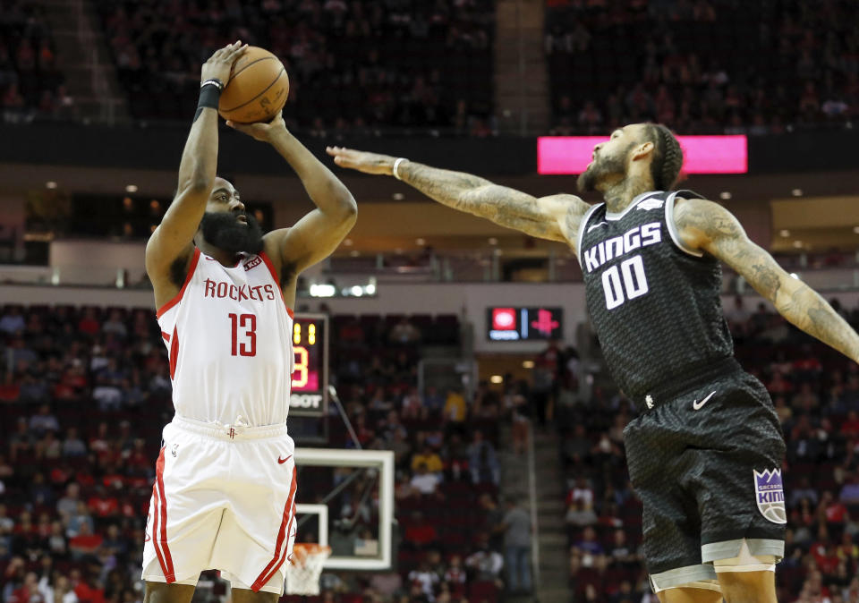 HOUSTON, TX - MARCH 30:  James Harden #13 of the Houston Rockets takes a three point shot defended by Willie Cauley-Stein #00 of the Sacramento Kings in the first half at Toyota Center on March 30, 2019 in Houston, Texas.  NOTE TO USER: User expressly acknowledges and agrees that, by downloading and or using this photograph, User is consenting to the terms and conditions of the Getty Images License Agreement.  (Photo by Tim Warner/Getty Images)