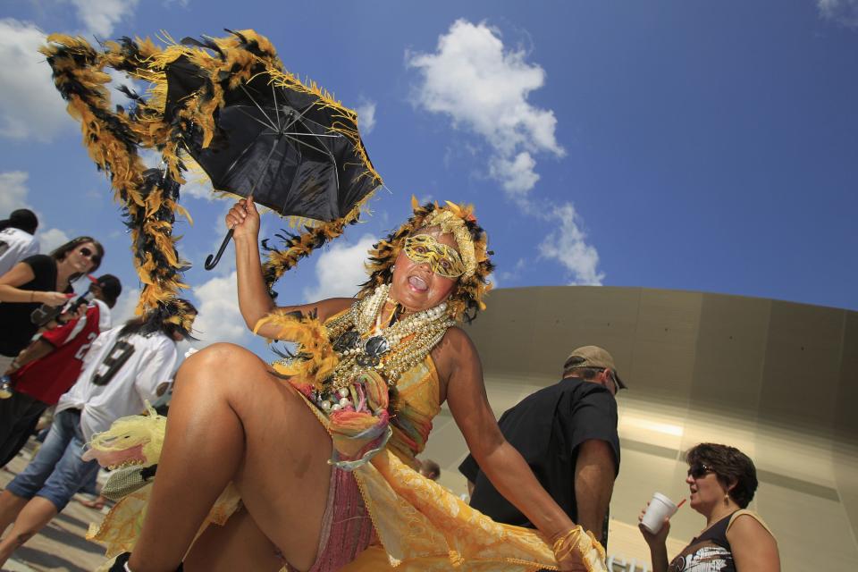 New Orleans Saints fans celebrate outside the Superdome prior to their NFL football game in New Orleans, Louisiana