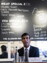 Britain's Chancellor of the Exchequer Rishi Sunak hosts a roundtable discussion for business representatives at Franco Manca restaurant in London, Thursday Oct. 22, 2020. The Chancellor is set to announce a new support package for businesses affected by coronavirus restrictions. (Stefan Rousseau/PA via AP)