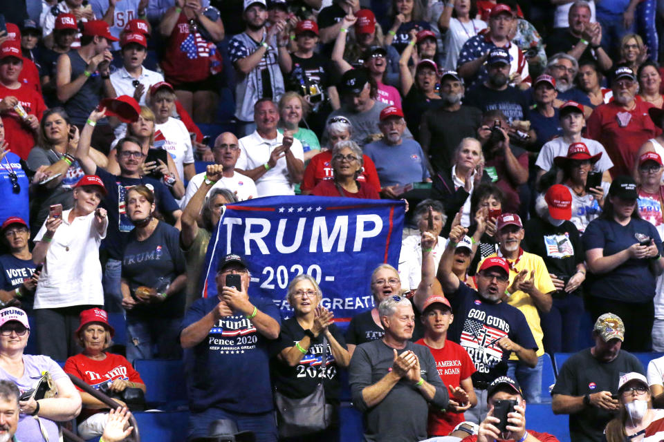 President Donald Trump supporters cheer Eric Trump, the son of President Donald Trump, not pictured, before a Trump campaign rally in Tulsa, Okla., Saturday, June 20, 2020. (AP Photo/Sue Ogrocki)