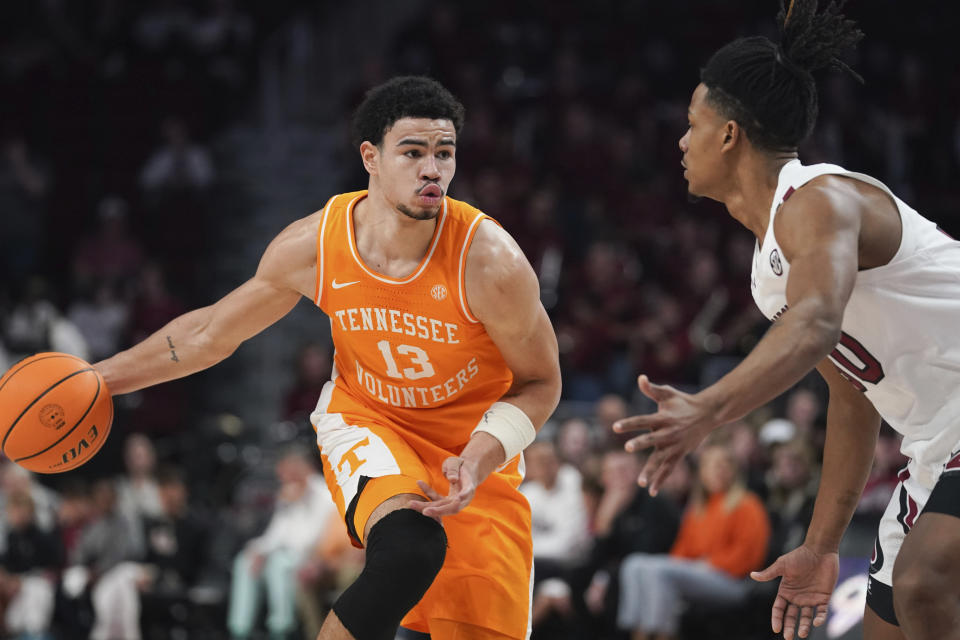 Tennessee forward Olivier Nkamhoua (13) looks to pass the ball during the first half of an NCAA college basketball game against South Carolina Saturday, Jan. 7, 2023, in Columbia, S.C. (AP Photo/Sean Rayford)