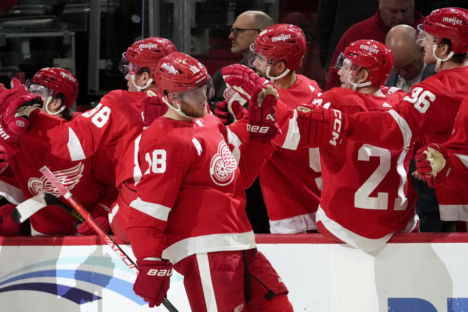 Detroit Red Wings center Andrew Copp (18) celebrates his goal against the Pittsburgh Penguins in the third period of an NHL hockey game Wednesday, Oct. 18, 2023, in Detroit. (AP Photo/Paul Sancya)