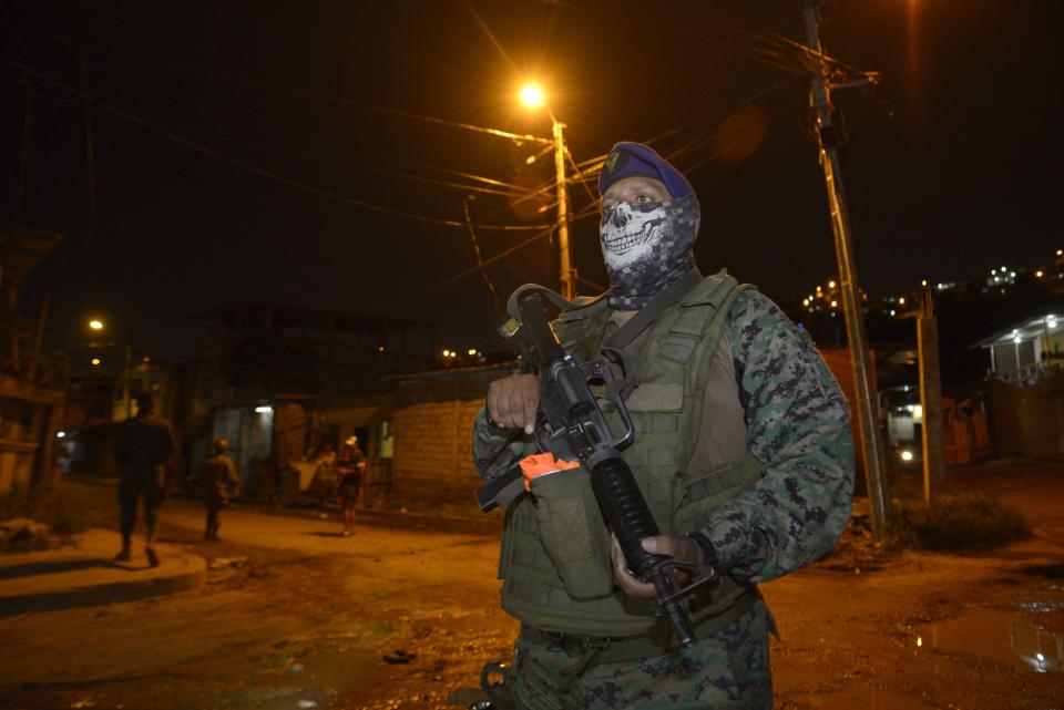 Soldiers patrol in Cerro Las Cabras, a canton located in the province of Guayas, Ecuador, on April 29, 2022. Ecuador's President Guillermo Lasso announced that he had decreed a 60-day state of emergency in three provinces with the highest levels of violence due to drug trafficking, which has led to hundreds of crimes and prison massacres. / Credit: MARCOS PIN/AFP via Getty Images