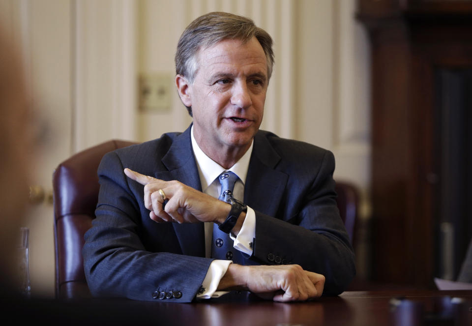 FILE - In this March 27, 2013, file photo, Tennessee Gov. Bill Haslam answers a question during a news conference after speaking to a joint session of the Legislature in Nashville, Tenn. Warren Buffett’s Berkshire Hathaway says the billionaire Haslam family tried to bribe at least 15 executives at the Pilot truck stop chain with millions of dollars to inflate the company’s profits this year because that would force Berkshire to pay more for the Haslams’ remaining 20% stake in the company. (AP Photo/Mark Humphrey, File)