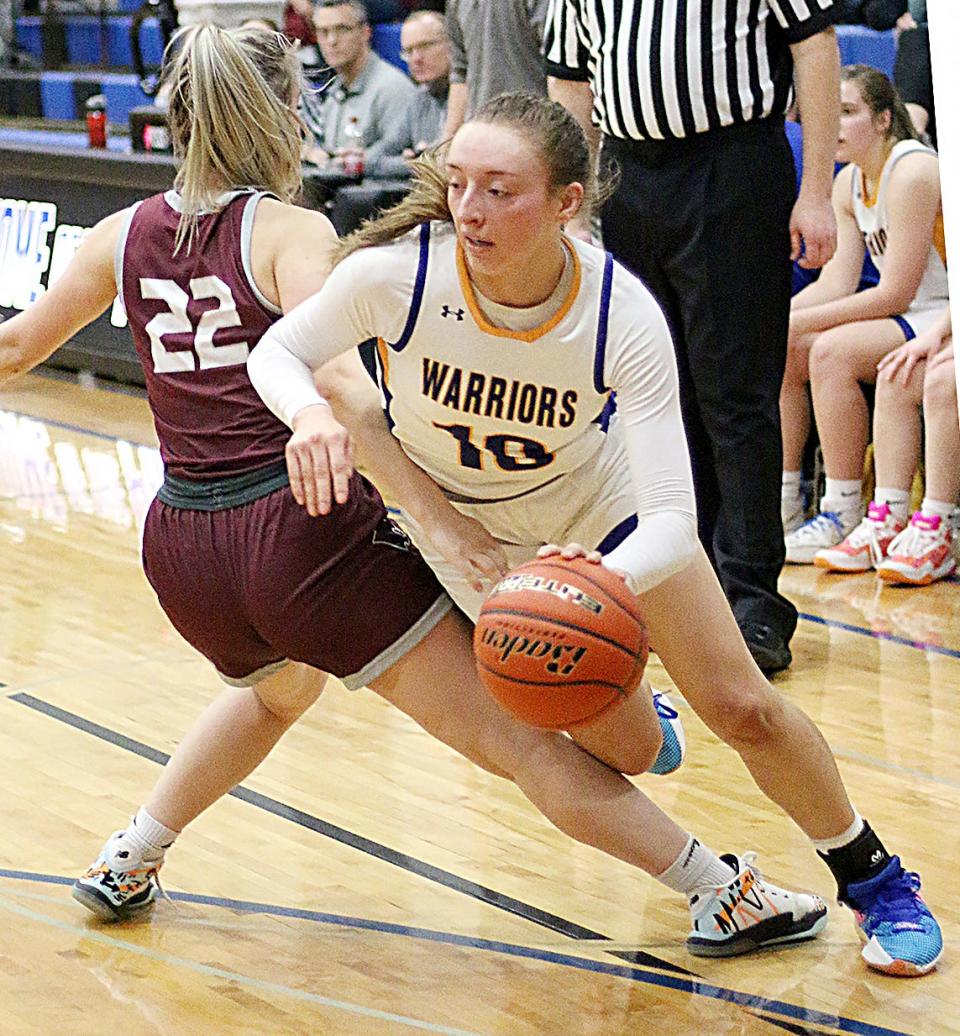 Castlewood's Mackenzie Everson drives around Timber Lake's McKenzi Vomacka during the Warriors' 74-46 SoDak 16 Class B state-qualifying girls basketball victory over Timber Lake on Thursday, March 2, 2023 in Redfield.