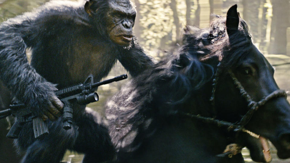 Koba riding into battle on a horse, while holding a gun, in Dawn of the Planet of the Apes.