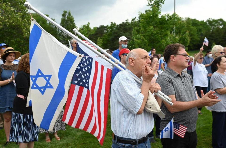 Efi Kamara, left, and Gil Nevat, listened as Jewish leaders spoke in support of Israel and peace in the Middle East during a “Vigil for Israel,” a community gathering Sunday, May 23, at the Jewish Community Center campus in Overland Park.