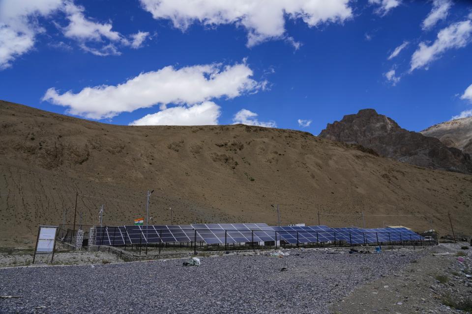 A row of solar panels for electricity have been set up in remote Kharnak village in the cold desert region of Ladakh, India, Sunday, Sept. 17, 2022. Authorities say they’re doing everything they can to stop the flight of nomads such as setting up solar panels for electricity, government-built prefab huts and water taps. (AP Photo/Mukhtar Khan)