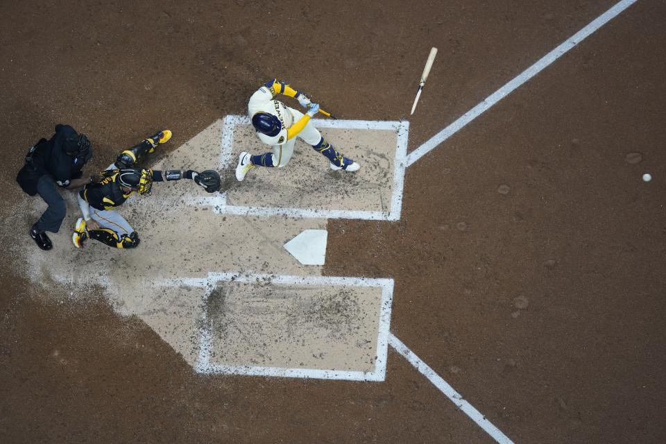 Milwaukee Brewers' William Contreras hits a broken bat single during the third inning of a baseball game Monday, May 13, 2024, in Milwaukee. (AP Photo/Morry Gash)