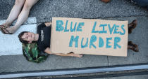 <p>A protester participates in a “Die-In” during a second day of demonstrations after a not guilty verdict in the murder trial of former St. Louis police officer Jason Stockley, charged with the 2011 shooting of Anthony Lamar Smith, who was black, in St. Louis, Mo., Sept. 16, 2017. (Photo: Lawrence Bryant/Reuters) </p>