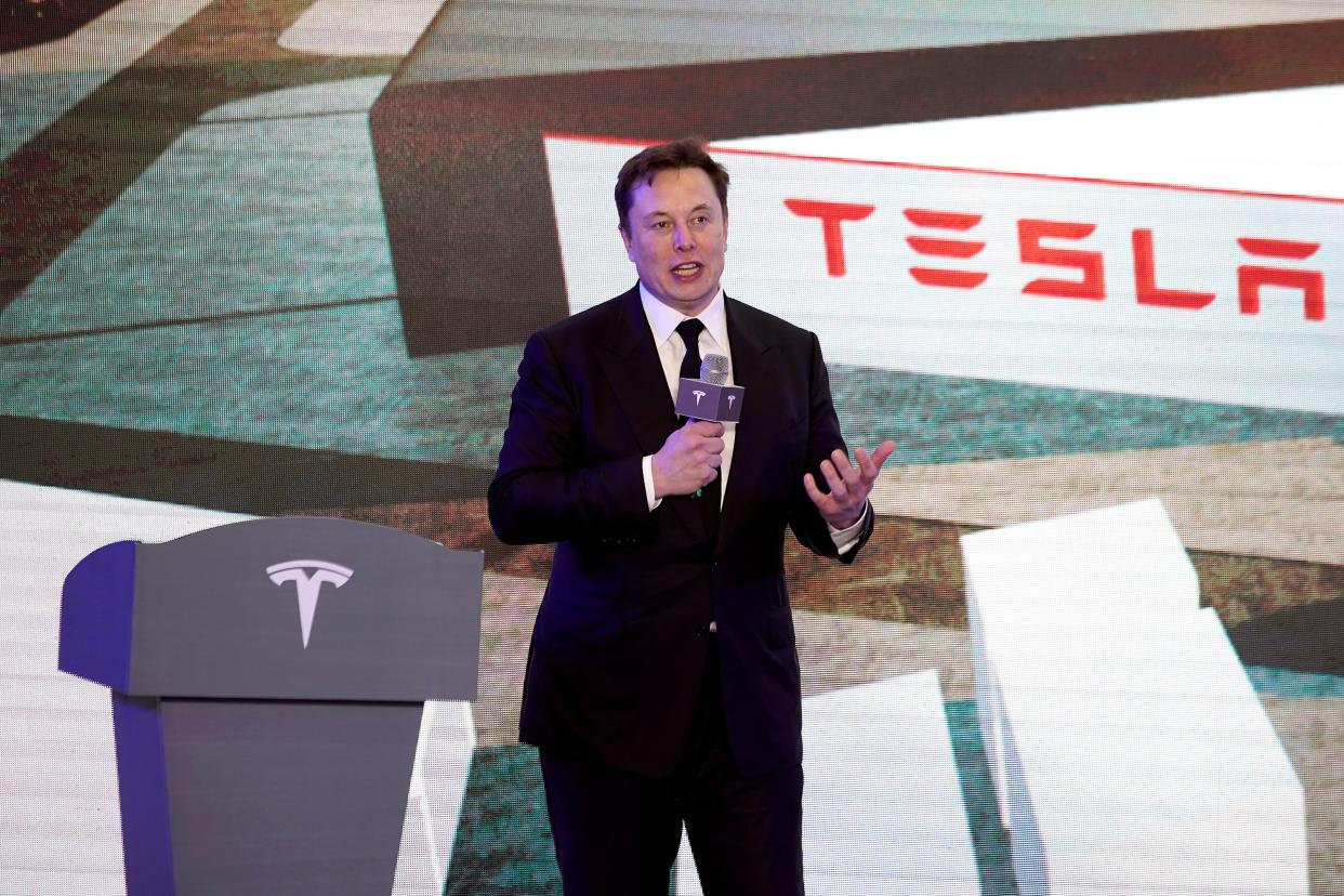 FILE PHOTO: Tesla Inc CEO Elon Musk speaks at an opening ceremony for Tesla China-made Model Y program in Shanghai, China January 7, 2020. REUTERS/Aly Song/File Photo