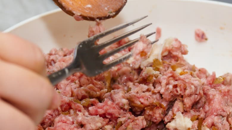 mixing meatloaf ingredients