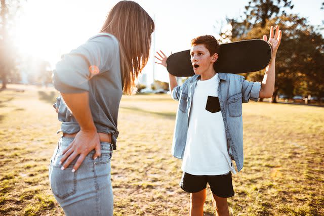 <p>Getty Images</p> Stock photo of mom and son in an argument.