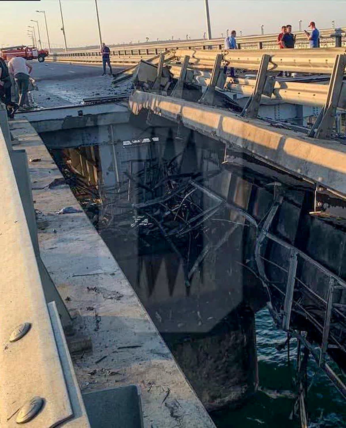 Damaged parts reportedly of an automobile link of the Crimean Bridge connecting Russian mainland and Crimean peninsula over the Kerch Strait not far from Kerch, Crimea (AP)