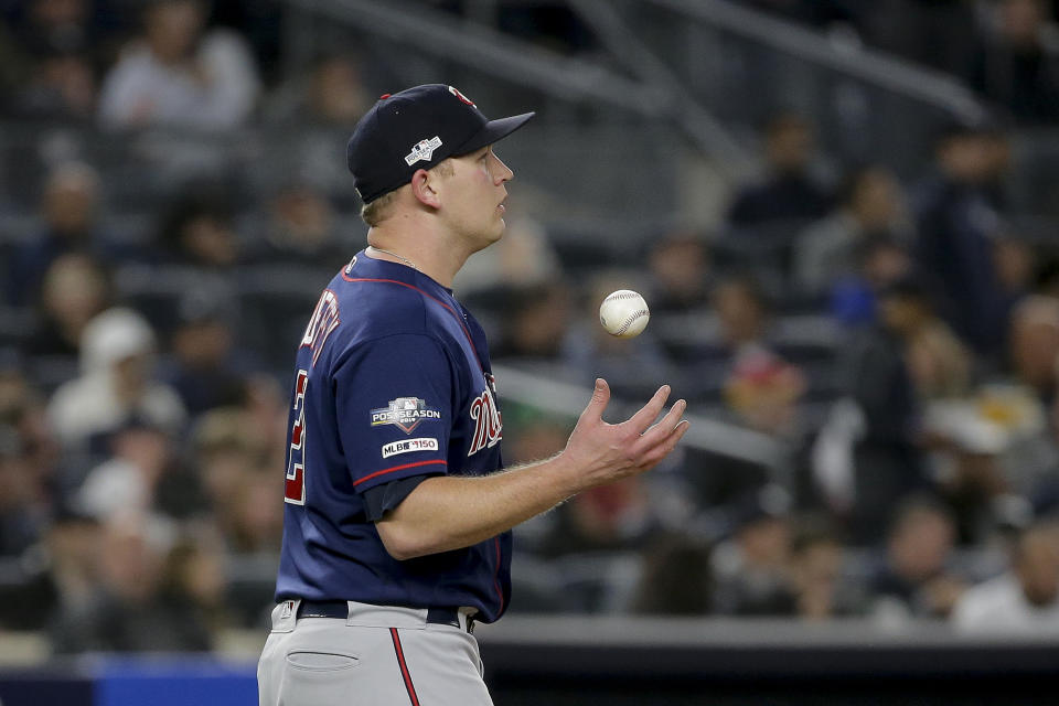 Minnesota Twins relief pitcher Tyler Duffey (21) flips the ball during the fifth inning of Game 1 of an American League Division Series baseball game against the New York Yankees, Friday, Oct. 4, 2019, in New York. (AP Photo/Seth Wenig)