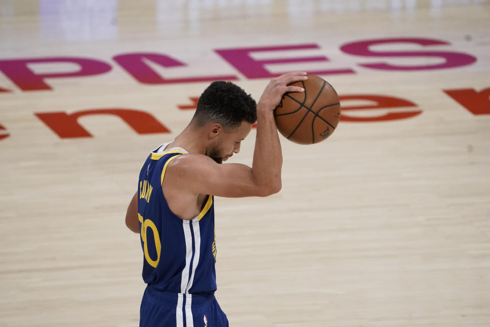 Golden State Warriors' Stephen Curry reacts to a foul call on his team during the first half of an NBA basketball game against the Los Angeles Lakers, Monday, Jan. 18, 2021, in Los Angeles. (AP Photo/Jae C. Hong)