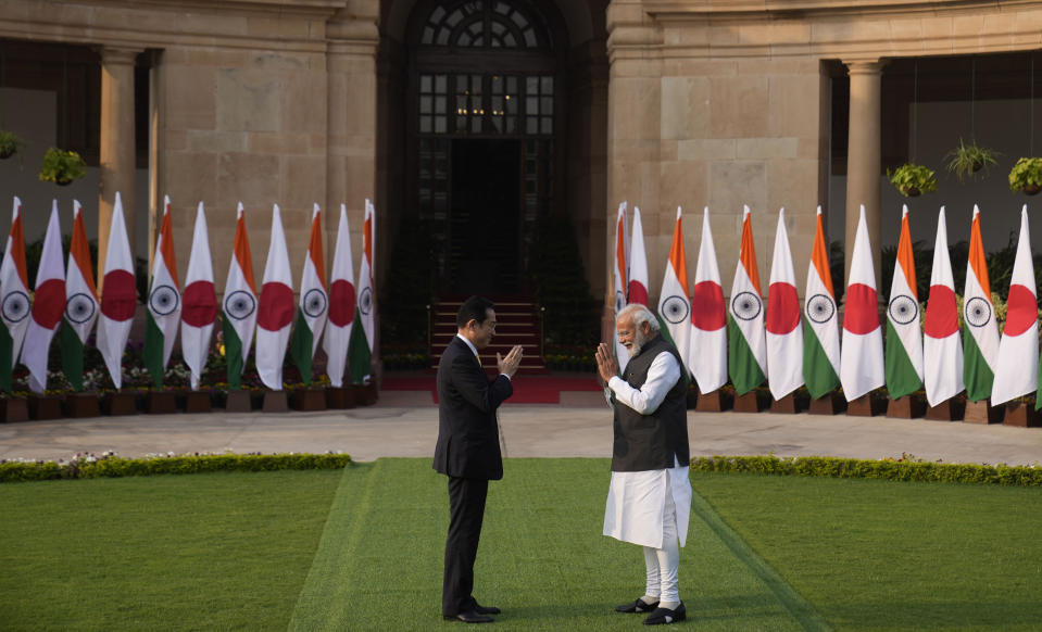 Indian Prime Minister Narendra Modi greets his Japanese counterpart Fumio Kishida in New Delhi, Saturday, March 19, 2022. Kishida is meeting with Modi to strengthen their partnership in the Indo-Pacific and beyond in view of China’s growing footprint in the region, an Indian official said Thursday. (AP Photo/Manish Swarup)
